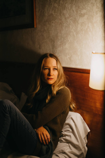 beautiful young woman sitting in hotel room - 写真・画像