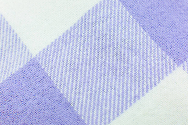 Checkered cloth texture. Purple and white squares on textile. Natural fabrics background. - Fotografie, Obrázek