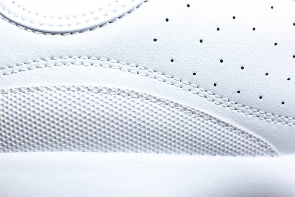 Modern sneakers  background. White leather trainers. Seams Close up. Natural fabrics, textile material. - Fotografie, Obrázek