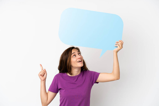 Young caucasian woman isolated on white background holding an empty speech bubble and thinking - Φωτογραφία, εικόνα