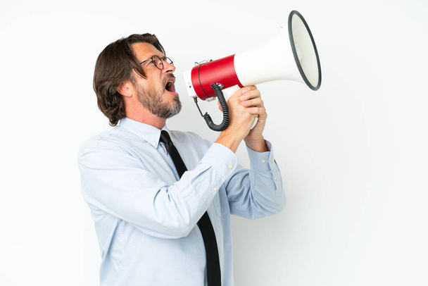 Senior dutch business man isolated on white background shouting through a megaphone - Fotografie, Obrázek