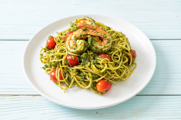 Spaghetti with prawns or shrimps in homemade pesto sauce - Healthy food style - Fotó, kép
