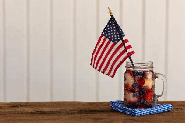 a red, white and blue fruit saled with a flag - Photo, image
