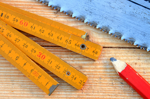 Handsaw, carpenter meter, pencil - Photo, Image