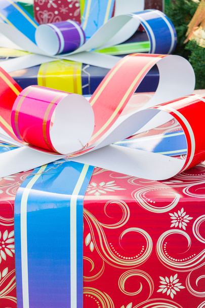 Colorful and striped boxes with gifts tied bow - Photo, Image