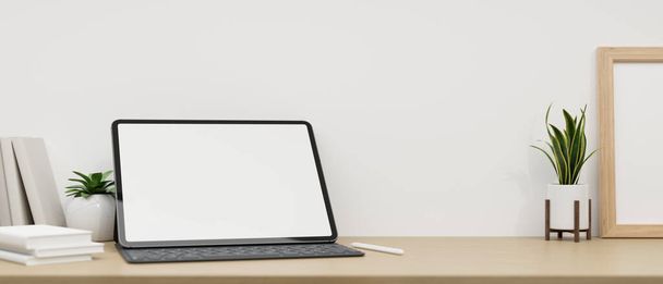 Minimaler Arbeitsplatztisch mit Tablet-Weißbildschirm-Attrappe, drahtloser Tastatur, Zubehör und Dekorationsanlage über weißer Wand. Nahaufnahme. 3D-Darstellung, 3D-Illustration - Foto, Bild