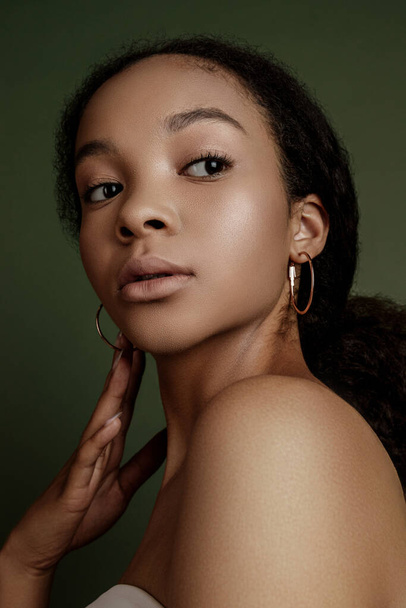 Beauty photo of young elegant African American woman with afro. Hands poses. Gentle portrait.  Fashion beauty close up portrait. Nude make-up. Studio photoshoot. Female model. Beautiful girl - Foto, afbeelding