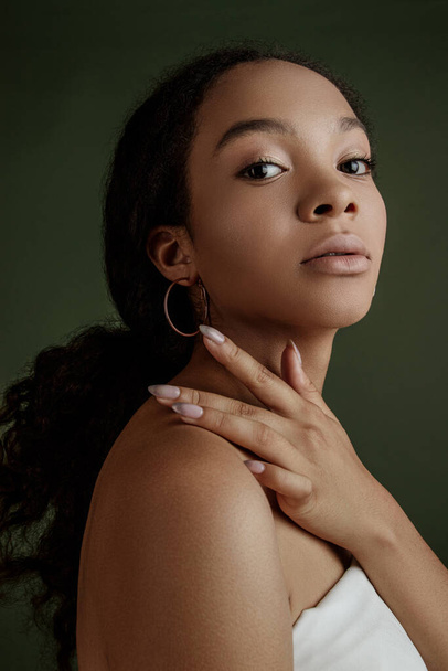 Beauty photo of young elegant African American woman with afro. Hands poses. Gentle portrait.  Fashion beauty close up portrait. Nude make-up. Studio photoshoot. Female model. Beautiful girl - Photo, image