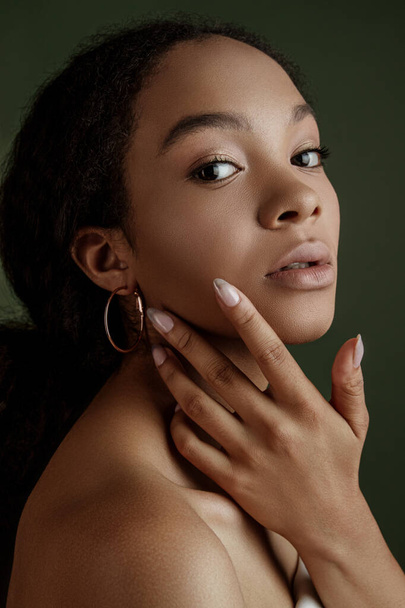 Beauty photo of young elegant African American woman with afro. Hands poses. Gentle portrait.  Fashion beauty close up portrait. Nude make-up. Studio photoshoot. Female model. Beautiful girl - Foto, Imagen
