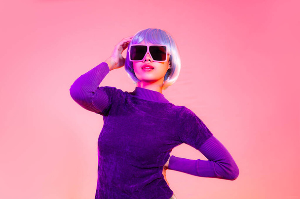 Cyber punk girl concept, asian woman in purple sweatshirt silver and blue short hair style wearing sunglasses. - Zdjęcie, obraz