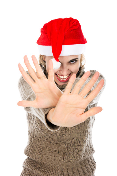 Dívka v Santa hat ukazuje rukou stop - Fotografie, Obrázek