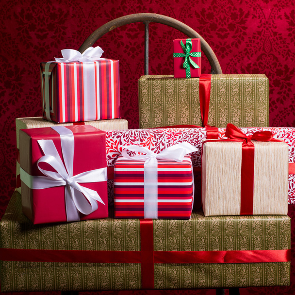Gifts for Holidays, Christmas, anniversary on beautiful red back - Φωτογραφία, εικόνα
