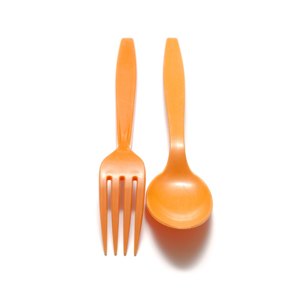 Orange plastic spoon and fork - Фото, зображення