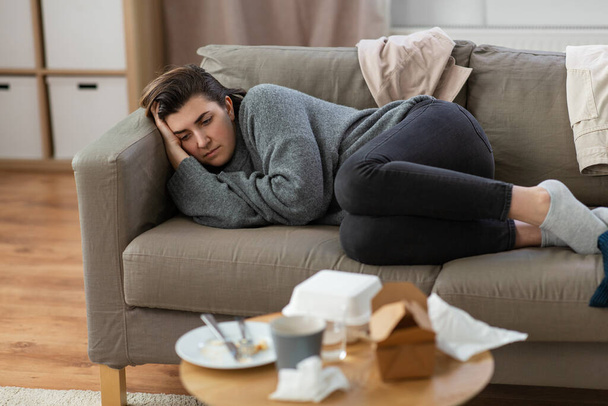 mental health, psychological problem and depression concept - stressed woman lying on sofa at home - Φωτογραφία, εικόνα