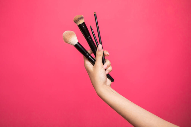 female hand with a brushes for makeup. High quality photo - Foto, imagen