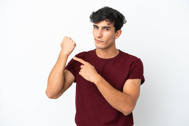 Young Argentinian man isolated on white background making the gesture of being late - Fotografie, Obrázek