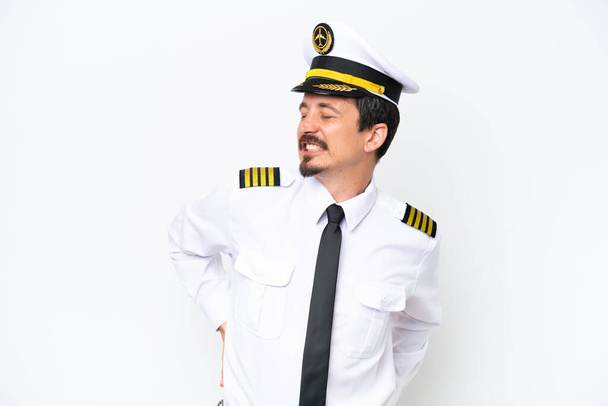 Airplane caucasian pilot isolated on white background suffering from backache for having made an effort - Φωτογραφία, εικόνα