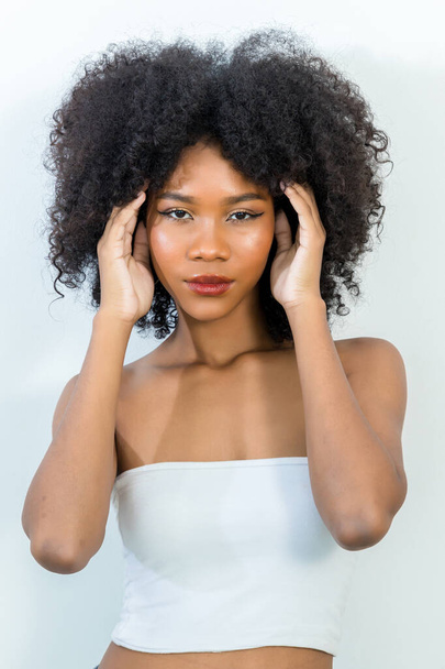 Portrait of African American woman with bushy curly hairstyle - Фото, зображення