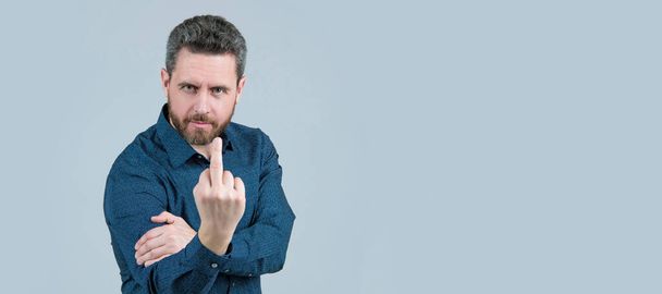 Flipping someone off. Bearded man show middle finger upwards. Obscene hand gesture, fuck you. Man face portrait, banner with copy space - Foto, immagini