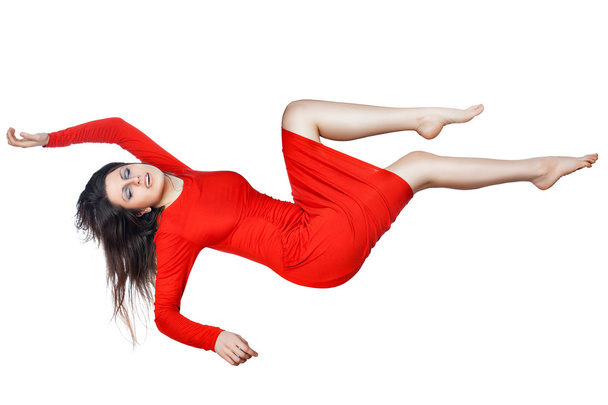 Levitates woman in a red dress. - Photo, Image