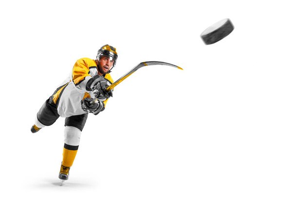 Hockey kick. Hockey player in the helmet and gloves on white background. Sports emotions. Action shot. Sport - Photo, Image