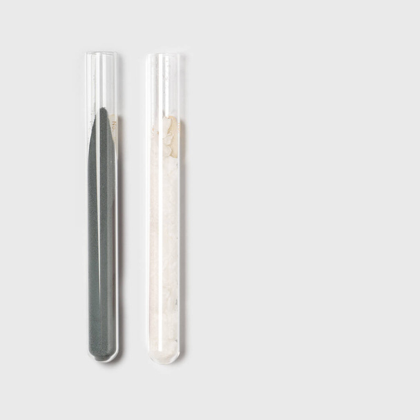 Closeup chemical ingredient on white laboratory table. Zinc Powder and Cetyl Esters Wax in test tube. - Foto, Imagem