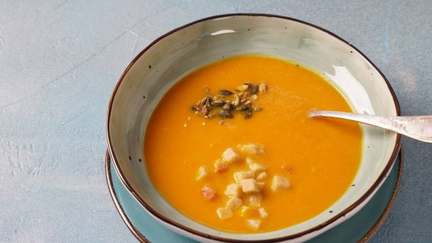 Creamy pumpkin soup with ginger. Healthy organic pumpkin cream soup - Photo, Image
