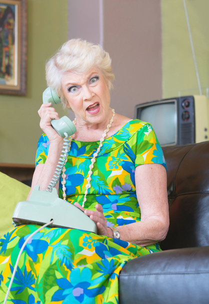 Angry Senior Woman talking on Phone - Fotó, kép