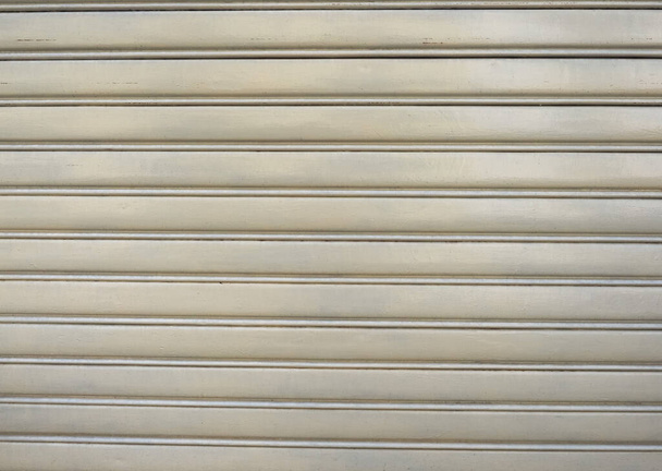 yellow aluminium rolling shutter metal texture useful as a background - Zdjęcie, obraz