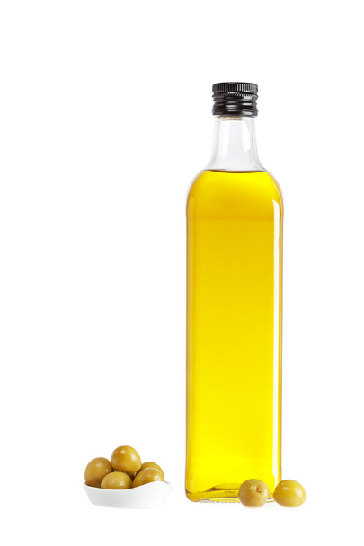 Olive oil bottle and some olives - Photo, Image