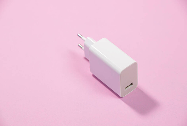 usb connector, plug on pink background, top view - Photo, image