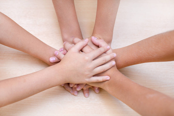 The children put their hands on each other. Concept of friendship. Concept of teamwork. - Foto, imagen