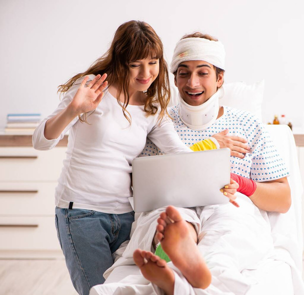 Loving wife looking after injured husband - Photo, Image