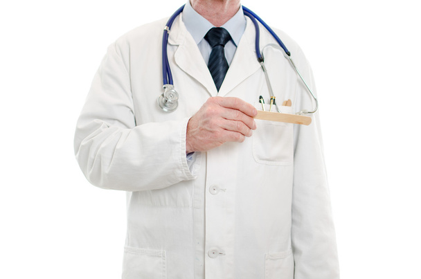 Médico segurando uma espátula de boca médica
 - Foto, Imagem