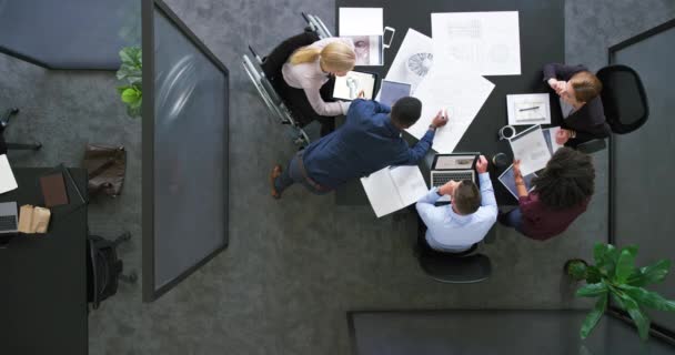 A group of architects working together on a project or building design. Top view of a diverse team of business people brainstorming in a meeting. Colleagues planning and discussing at a company. - Πλάνα, βίντεο