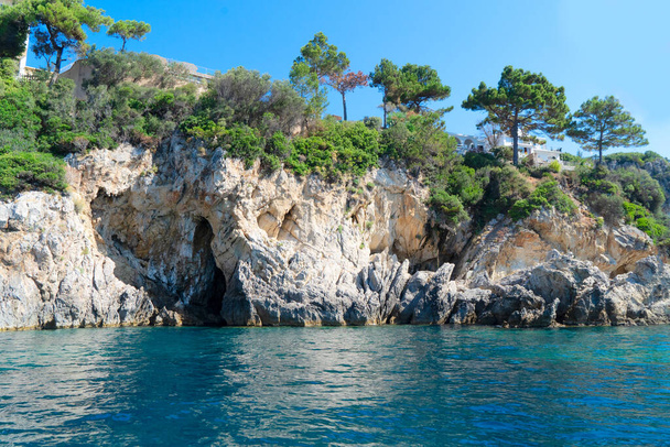Paleokastritsa blue caves, pines and Ionian sea on Korfu, Greece - Fotó, kép