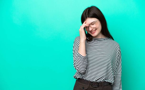 Young Russian woman isolated on green background laughing - Photo, Image