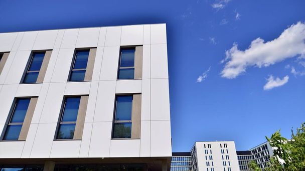 Office building with white aluminum composite panels. Facade wall made of glass and metal. Abstract modern business architecture. - Valokuva, kuva