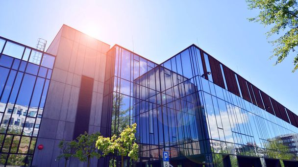 Architecture details. Modern glass building facade in sunny day. Business background. - Φωτογραφία, εικόνα