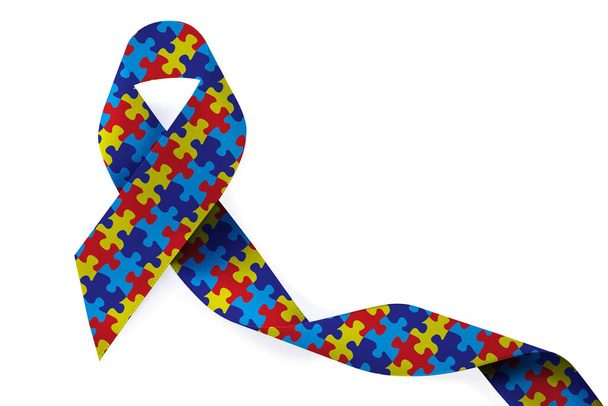 World Autism Awareness Day. Colorful puzzle ribbon on white background, top view - Foto, afbeelding