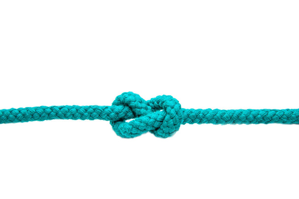 Knot on a cord close-up, isolated on a white background. - Фото, зображення