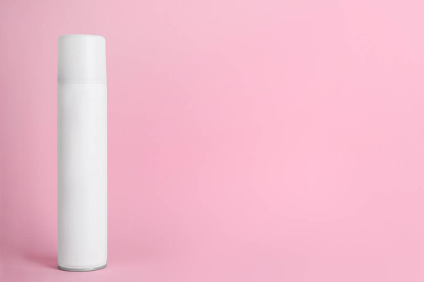 Bottle of dry shampoo on pink background, space for text - Zdjęcie, obraz