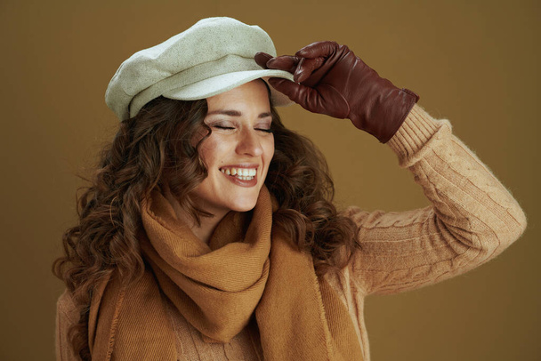 Hello september. smiling elegant woman in scarf with leather gloves isolated on beige background. - Foto, Bild