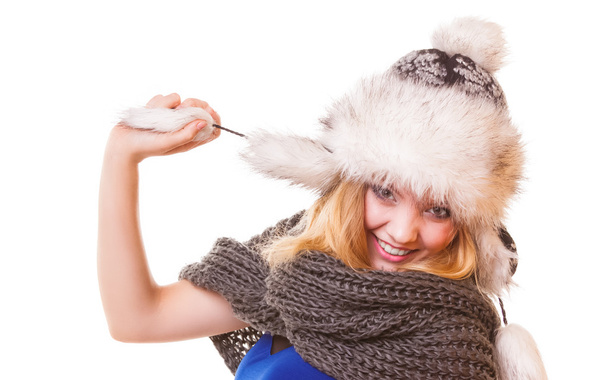 Winter fashion girl in fur hat doing fun isolated - Фото, изображение