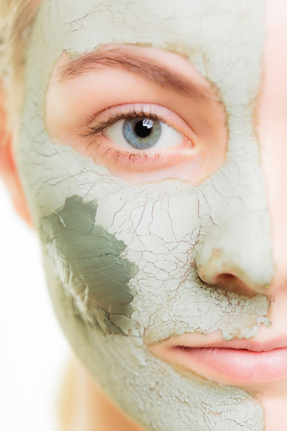 Woman in clay mud mask on face. - Fotoğraf, Görsel