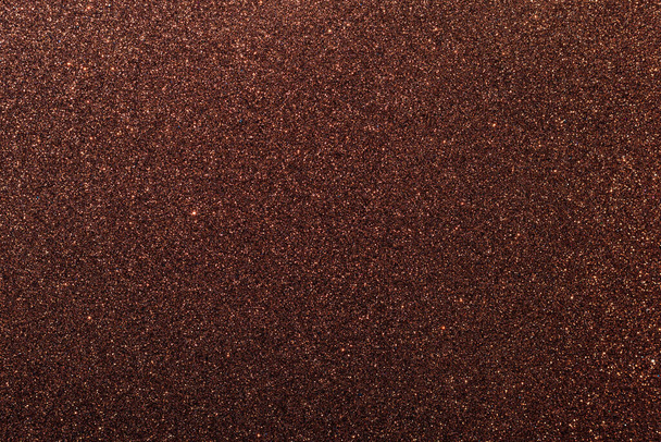 Background with sparkles. Backdrop with glitter. Shiny textured surface. Very dark red. Soft light - Valokuva, kuva