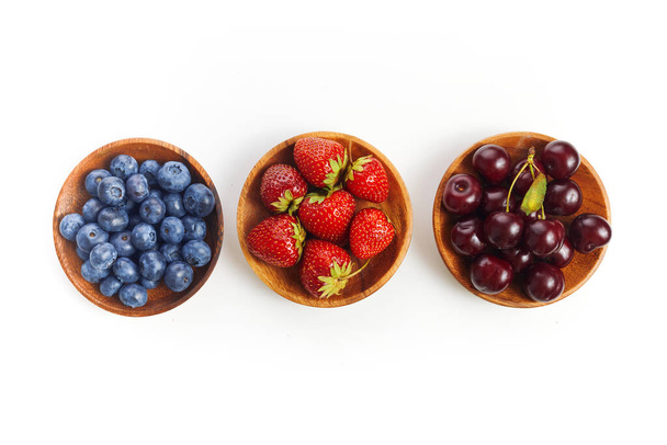 Berries mix in in a bowls on white background. - Foto, Imagen
