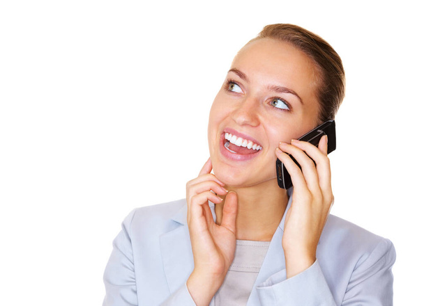 Happy young business woman having a conversation on cellphone isolated on white. - 写真・画像