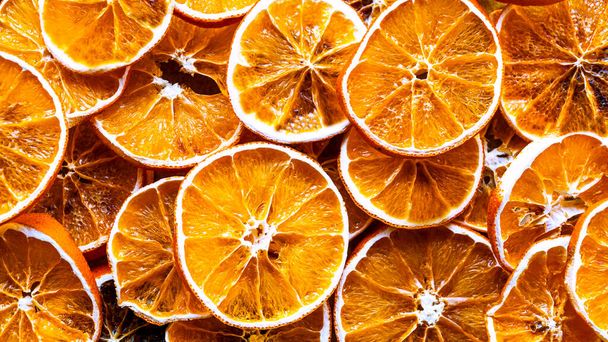 Dried orange. Dried orange slices background. High angle view. Top view of citrus fruit texture close-up. Selective focus included. High quality photo - Fotografie, Obrázek