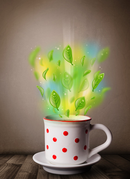 Tea cup with leaves and colorful abstract lights - Foto, Imagen